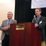 Jim Brown announces special speaker Rick Hill at the Vendor's Buffet.