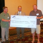 ICBA chairman-elect Bill Loving presents MIB with a sizeable royalty check.