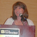 State Auditor Monica Lindeen updates the attendees on health care changes.
